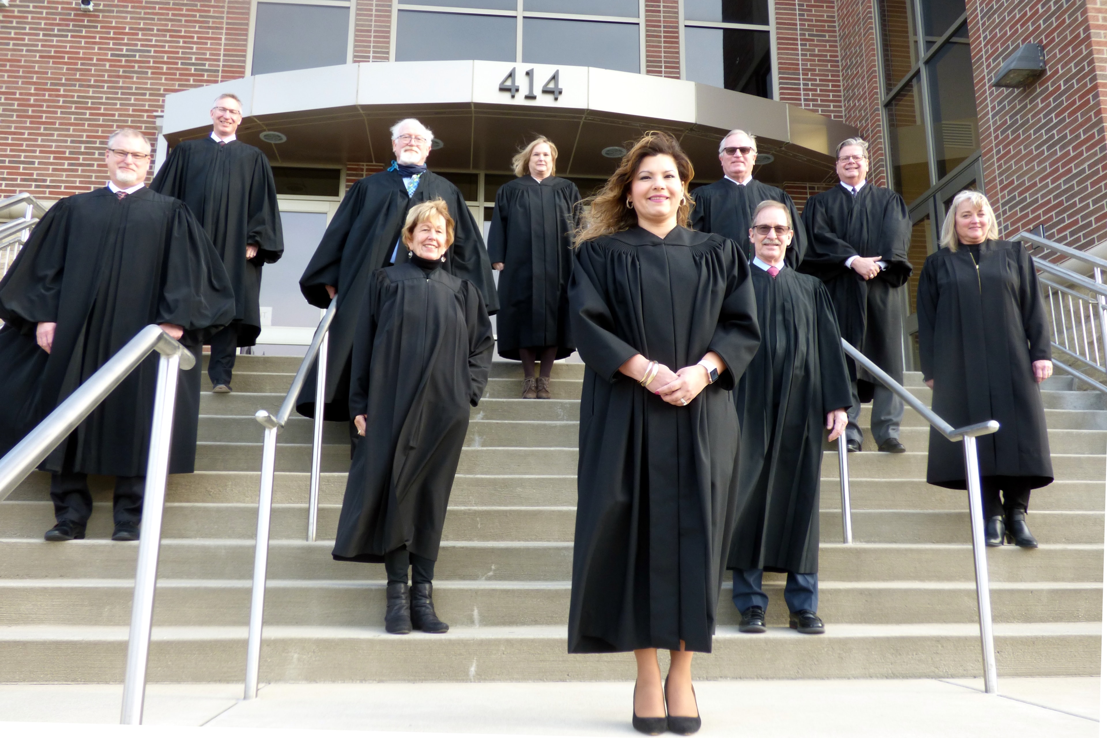 Judge Juanita Bocanegra and fellow judges standing outside the courthouse